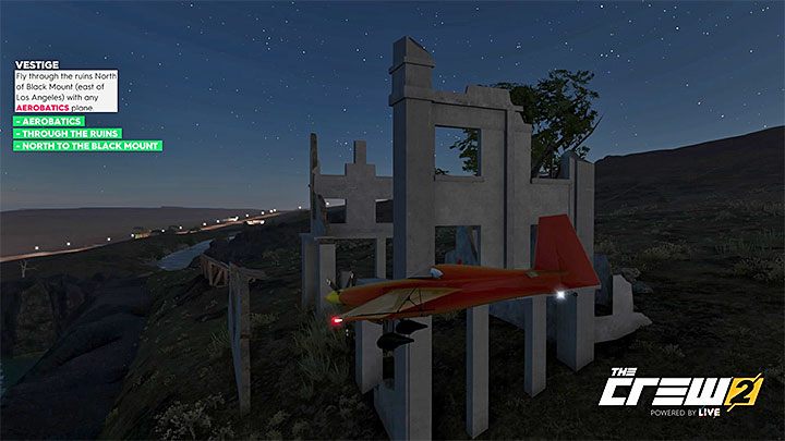 Description: Fly through the ruins North of Black Mount (east of Los Angeles) with any Aerobatics plane - The Crew 2: Album - Freestyle - The Crew 2: Photo Ops - The Crew 2 Game Guide