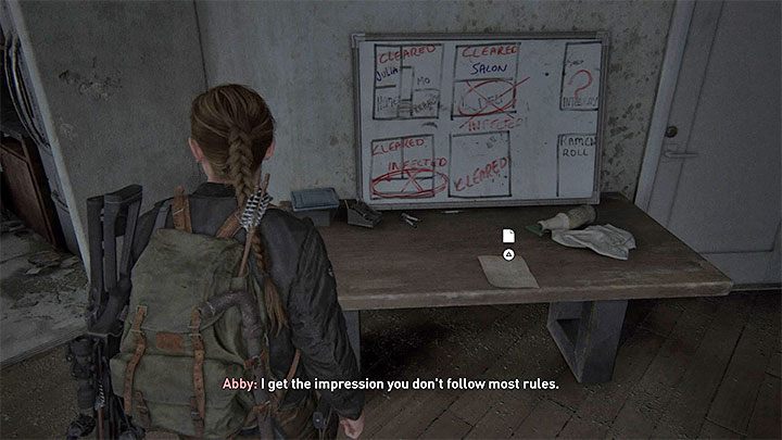 The document is on a table next to a whiteboard which contains a drawing of flats - The Last of Us 2: The Shortcut - collectibles, artefacts, coins - Seattle Day 2 - Abby - The Last of Us 2 Guide