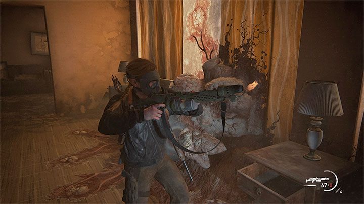 The flamethrower lies next to the corpse in the dark room - The Last of Us 2: How to get Flamethrower? - Combat - The Last of Us 2 Guide
