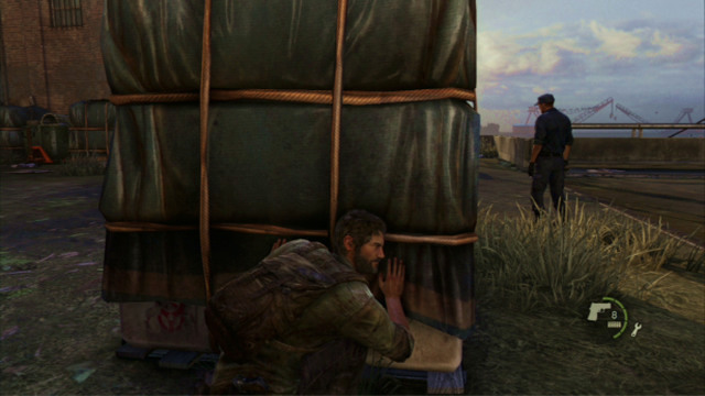 To eliminate the remaining enemies, take cover behind the cargo crate and wait for the two soldiers to turn away from you - The Last of Us: The Cargo, The Quarantine Zone Walkthrough, map - The Quarantine Zone - The Last of Us Guide