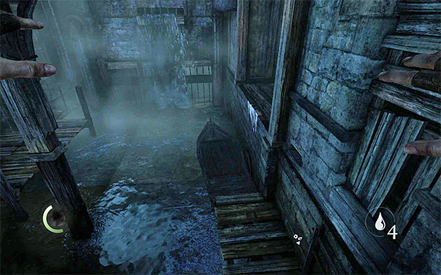 Take a turn to the right, immediately, and approach the crates suspended down from the crane - Reach Erins hideout - description - The City - Thief - Game Guide and Walkthrough