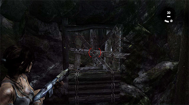 Turn left and blast through the characteristic barricade - GPS Caches | Collectibles: Summit Forest - Collectibles: Summit Forest - Tomb Raider Game Guide