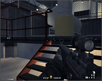 Keep heading forward, however the second you see more terrorists heading your way, go back and hide behind barrels (screen) - Scene 2 - Furnaces - part 1 - Act 6 - Nevada Desert - Tom Clancys Rainbow Six: Vegas 2 - Game Guide and Walkthrough