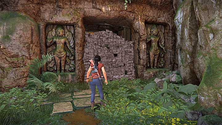 Approach the damaged wall and use a grenade or a grenade launcher to topple it - 4- Hoysalas Tokens and the Queens Ruby - Walkthrough - Uncharted: The Lost Legacy Game Guide