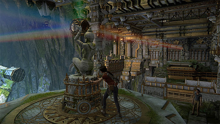 After you have used hook and rope to reach another part of the large cave, approach the first statue with a prism atop - Solution to the puzzle with prisms - Walkthrough - Uncharted: The Lost Legacy Game Guide