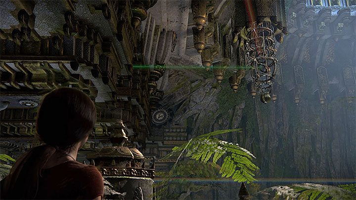 At this stage of the puzzle, the beam should reflect from the third statue and from the mirror inside the hanging cage in the center (the one you used to get here) - Solution to the puzzle with prisms - Walkthrough - Uncharted: The Lost Legacy Game Guide