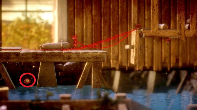 Theres a button under the boards. Use a piece of wood to sail there - Level 5 - Off the Rails - Secret collectibles - buttons - Unravel - Game Guide and Walkthrough